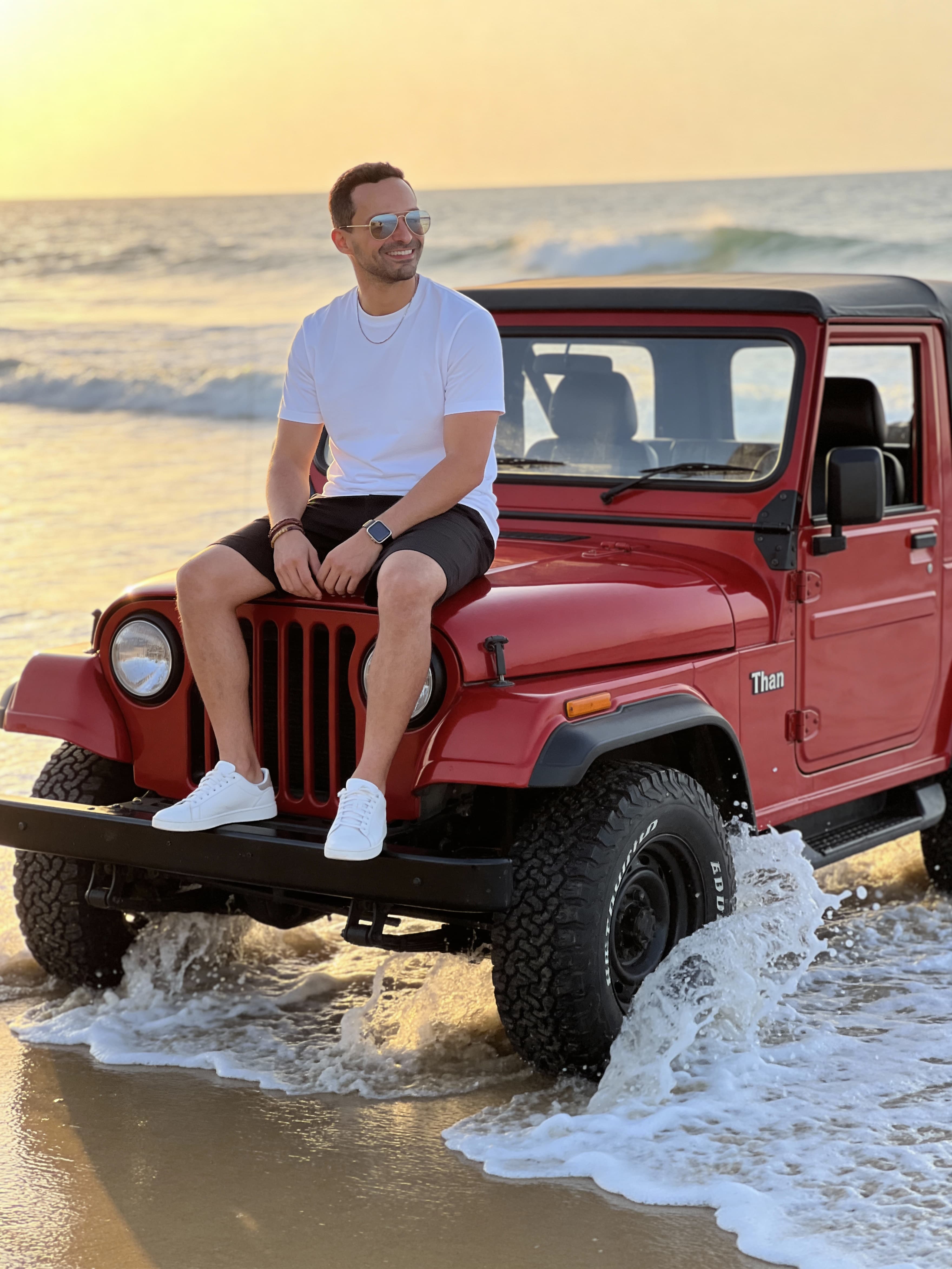 Example: cinematic portrait on a beach jeep with ocean spray
